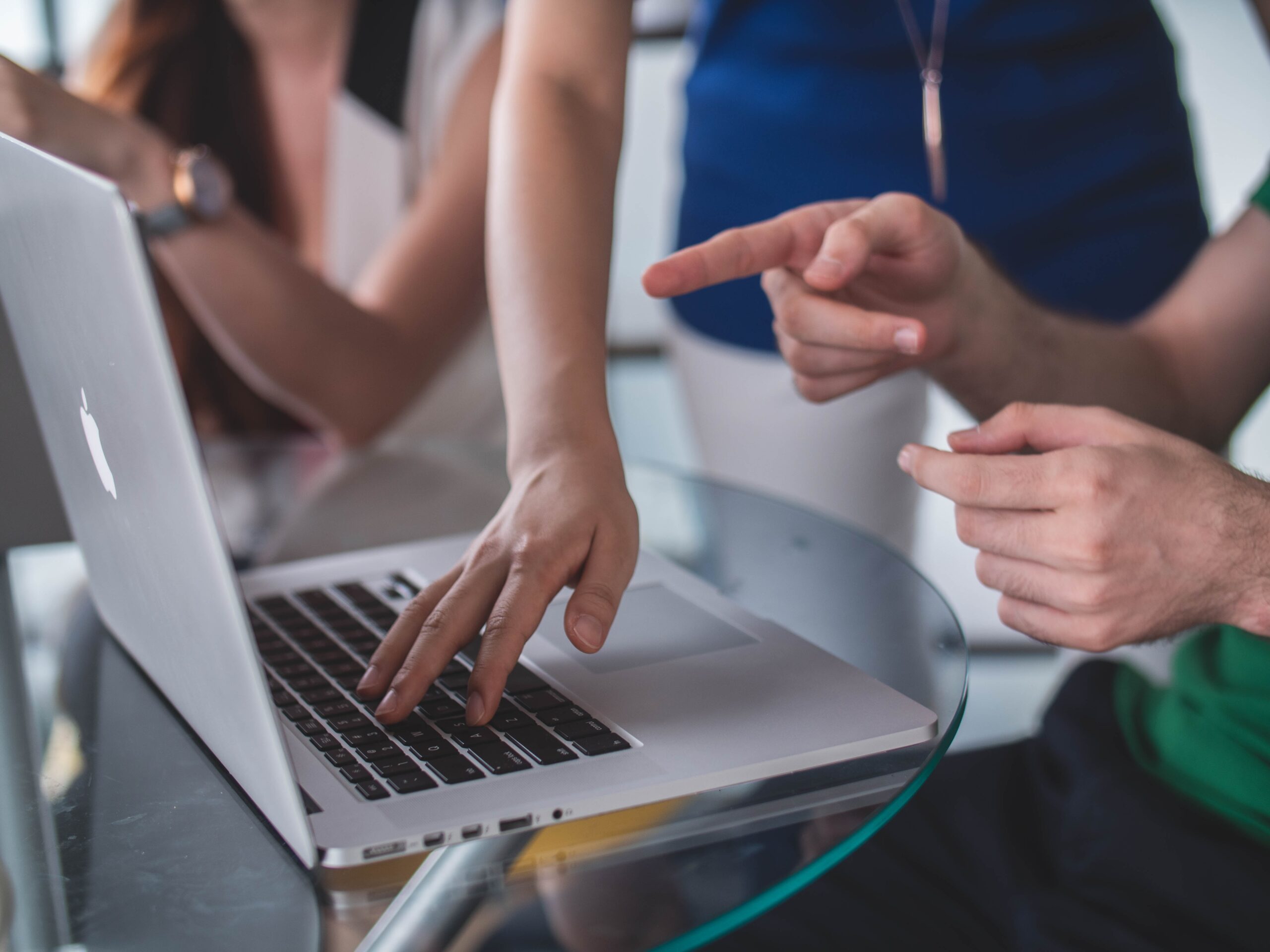 two people working on a laptop